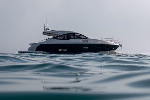 a black and white yacht in water