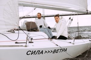 sail yachting - three man crew on deck