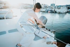 Female yacht crew in a marina
